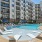 Resort-Style Pool and Sun Shelf with Lounge Chairs